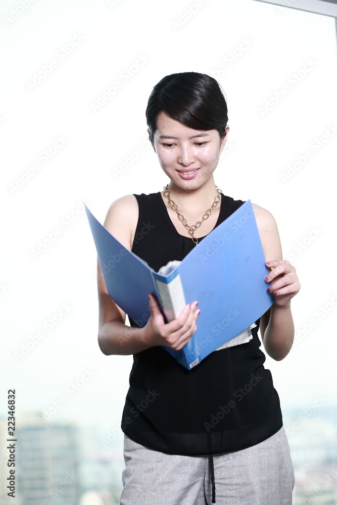 young asian business woman holding with folder young asian business woman holding with folder