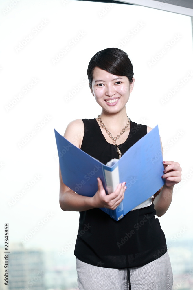 young asian business woman holding with folder young asian business woman holding with folder