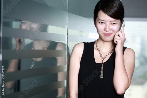 young asian business woman use mobiel phone photo