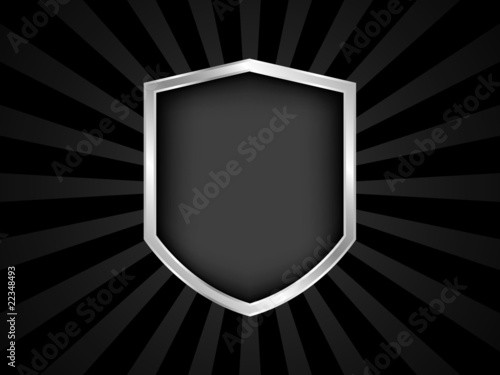 Black and silver shield emblem on black background