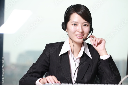 young asian woman with headset photo