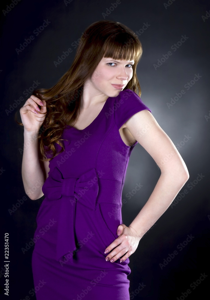 stunning woman in purple dress on black background stunning woman in purple dress on black background