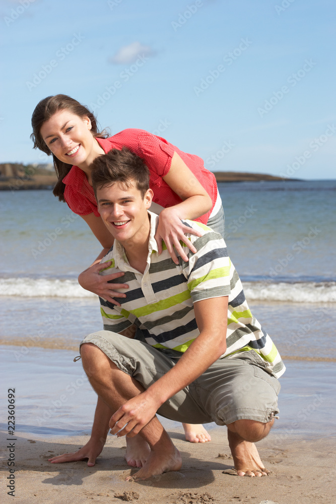 Affectionate Teenage Couple Having Fun On Beach Affectionate Teenage Couple Having Fun On Beach