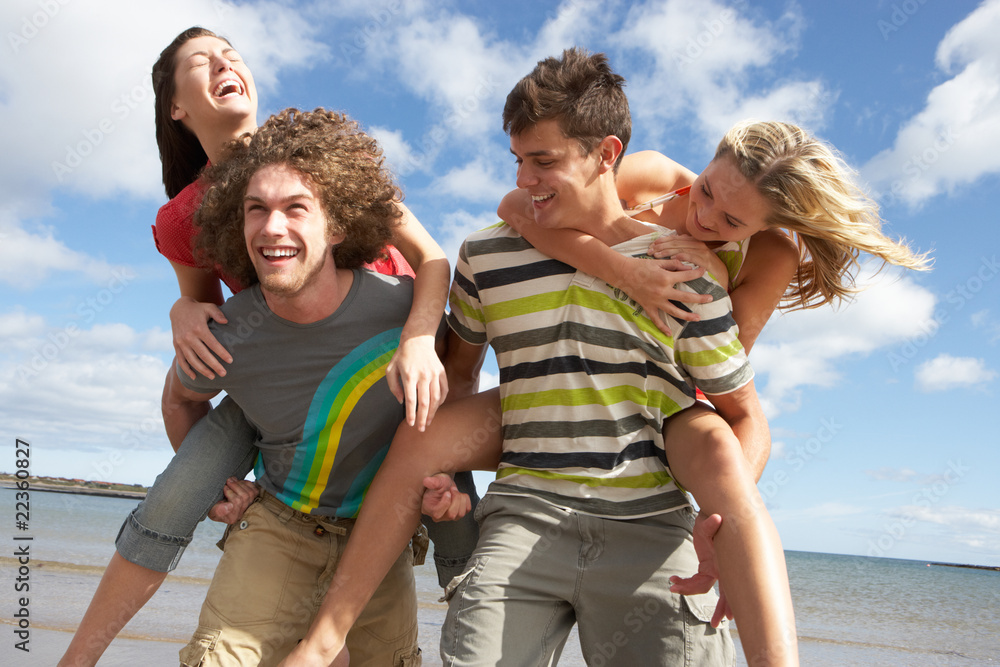 Group Of Young Friends Having Fun On Summer Beach Together Group Of Young Friends Having Fun On Summer Beach Together