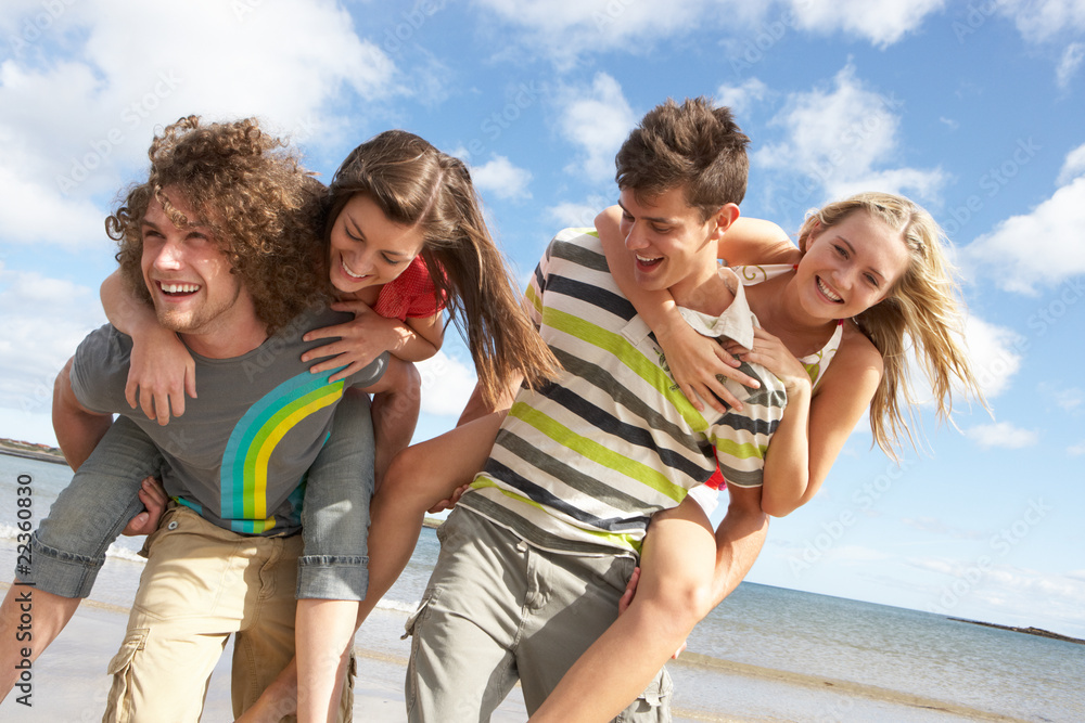 Group Of Young Friends Having Fun On Summer Beach Together Group Of Young Friends Having Fun On Summer Beach Together