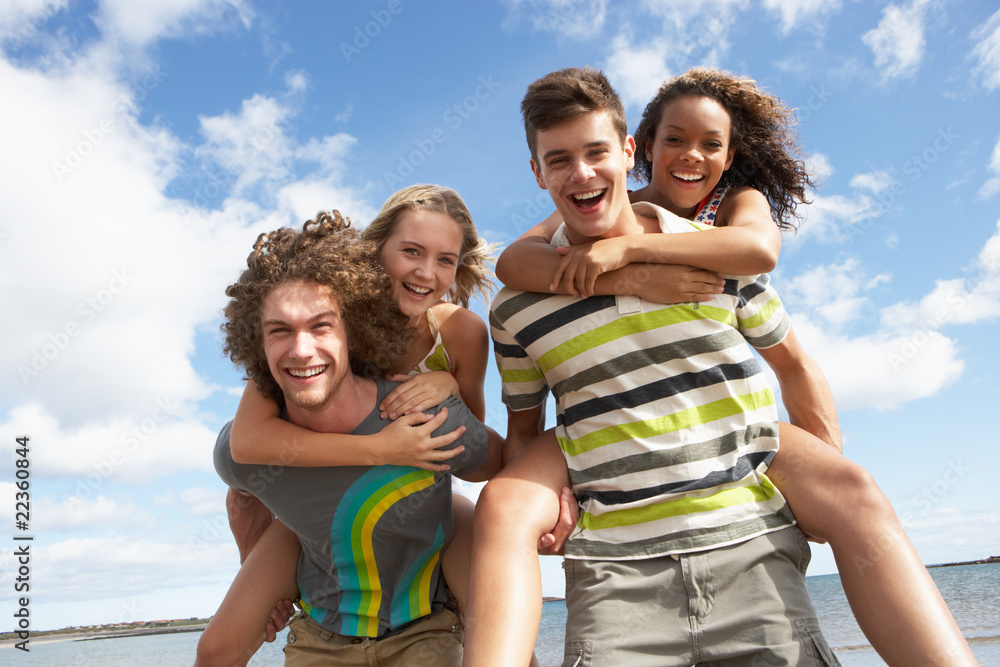 Group Of Young Friends Having Fun On Summer Beach Together Group Of Young Friends Having Fun On Summer Beach Together