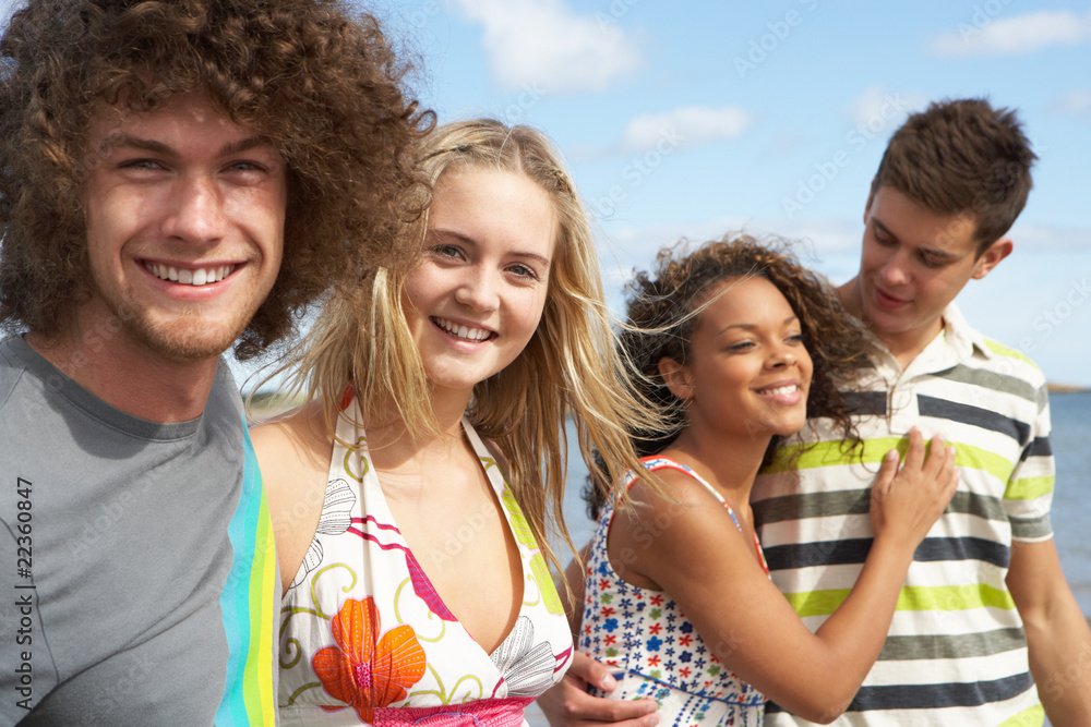 Group Of Young Friends Having Fun On Summer Beach Together Group Of Young Friends Having Fun On Summer Beach Together