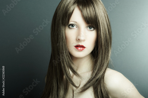 The young sexual girl in chestnut-coloured wig