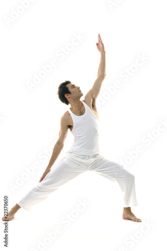 young male is making yoga