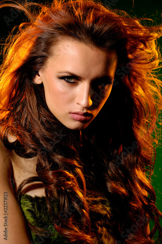 Close up expressive look of fashion model with funning hairs