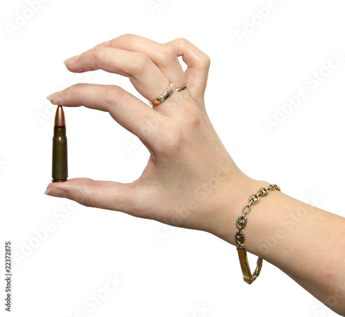 Woman holding 7.62x39 caliber cartridge in hand photo