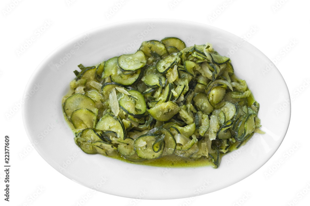 Courgettes sliced thinly and cooked with olive oil and onions.