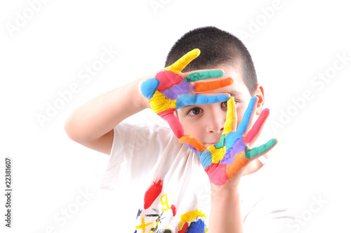 Happy kid with paints on hands framing