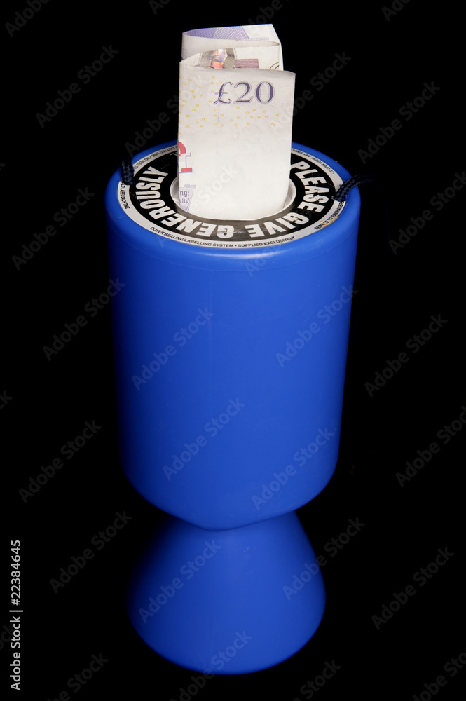 Charity collection tin with twenty pounds Charity collection tin with twenty pounds