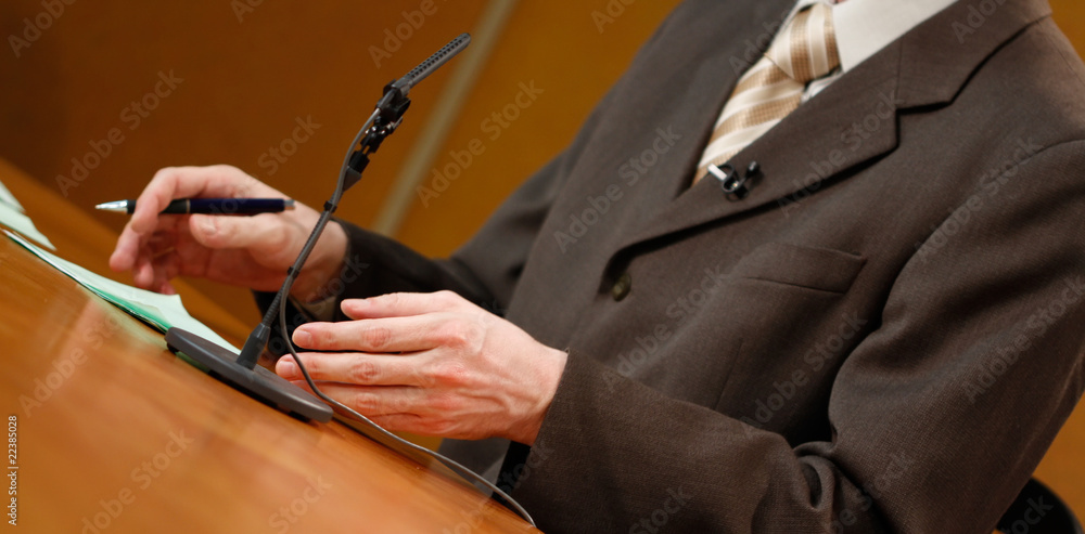 Fototapeta premium Speaker talking to the microphone