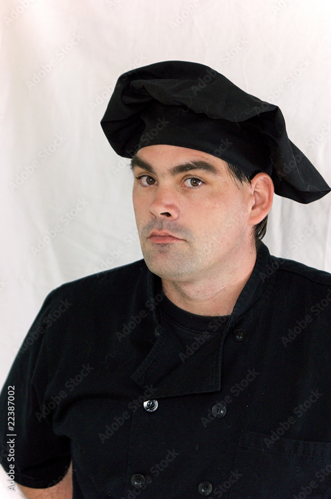 serious chef dressed in black serious chef dressed in black