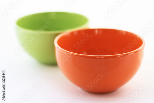 Multi-coloured cups on a white background