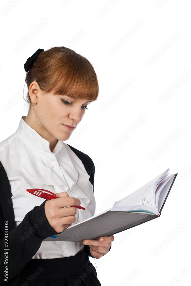 Female writing in organiser isolated on white background Female writing in organiser isolated on white background