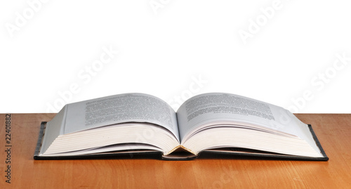 Open book on desk on white background