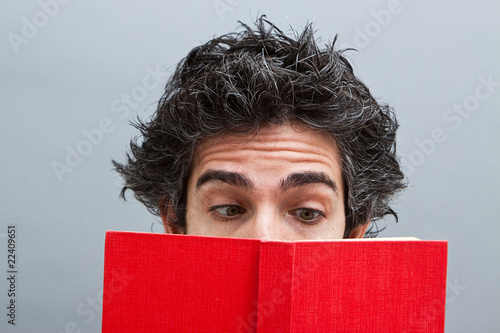 Young man reading a book