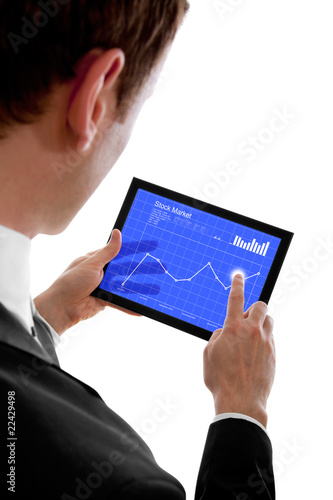 Businessman holding a touchpad pc, checking the stock market