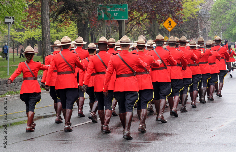 troop of Canadian mountie police marching