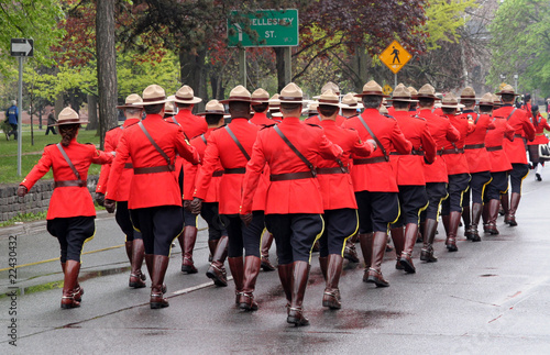troop of Canadian mountie police marching
