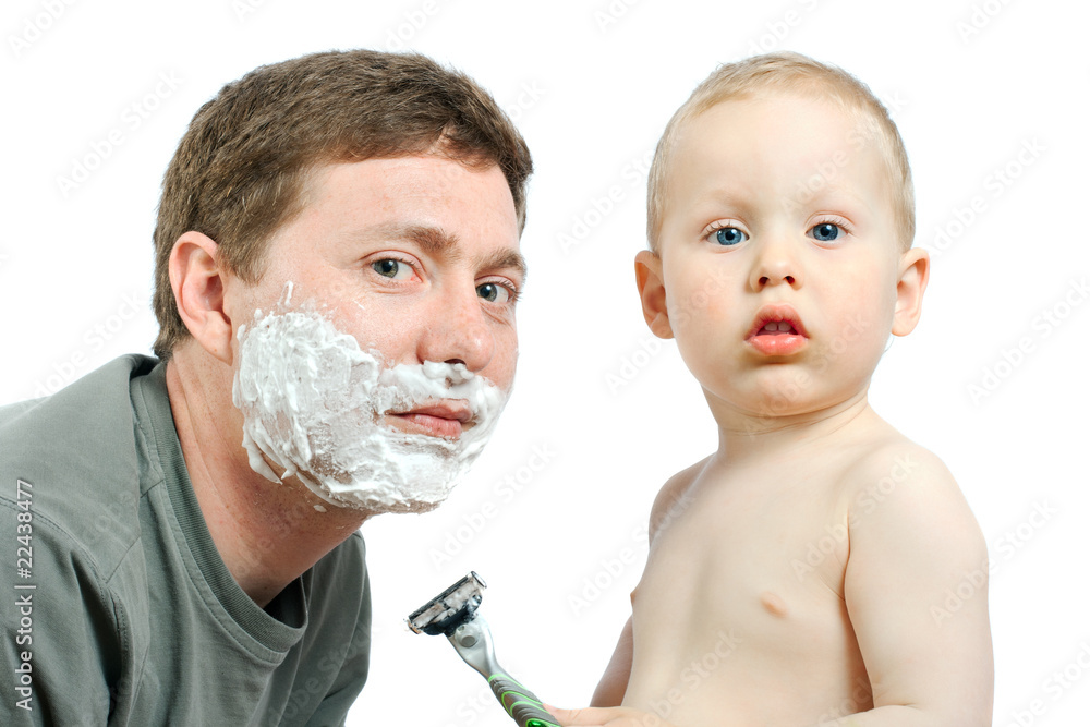 boy shaving father