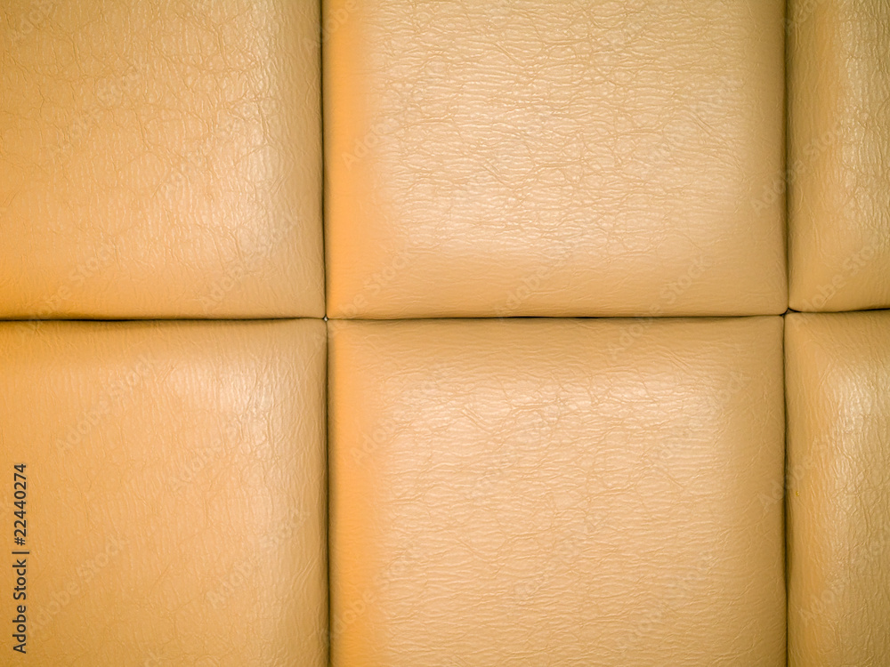 Fototapeta premium Tan Leather Upholstry Background with a Repetitive pattern