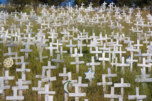 White crosses on a hillside photo