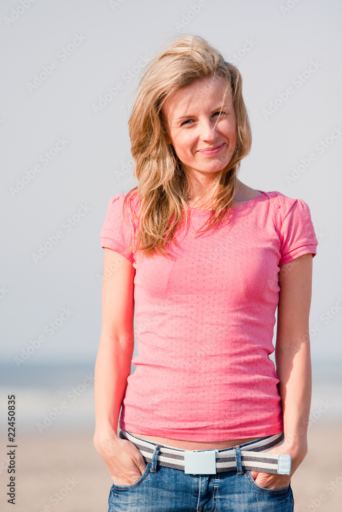 Young woman on sea shore
