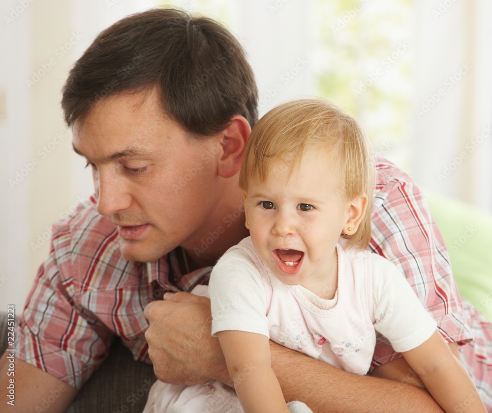 Father holding baby girl Father holding baby girl