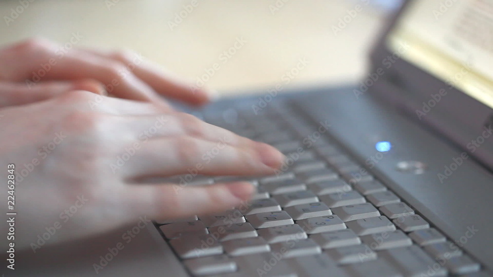 Young woman typing on laptop keyboard. Young woman typing on laptop keyboard.