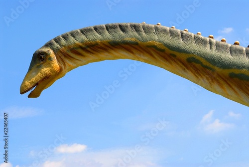 Dinosaur diplodok (diplodocus) on the blue sky background