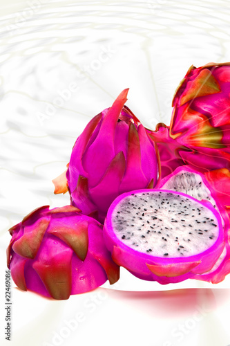 whole and two half of dragon fruit