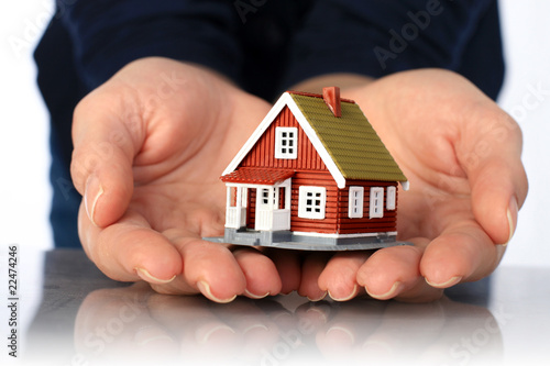 Hands and small house.