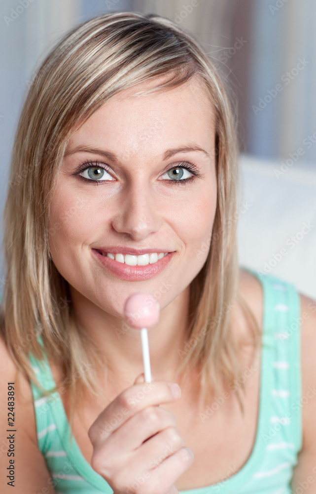 Radiant woman holding a lollipop Radiant woman holding a lollipop