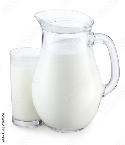 Pitcher and glass of milk on a white background