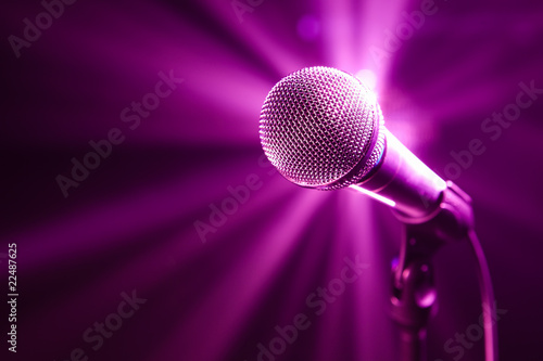 microphone on stage with purple background