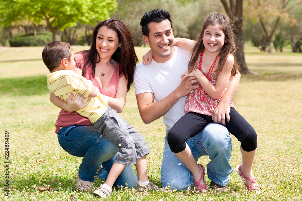 Happy family enjoying in the park Happy family enjoying in the park