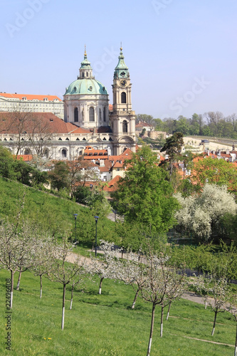 Sticker Prague's St. Nicholas' Cathedral with flowering trees and grass