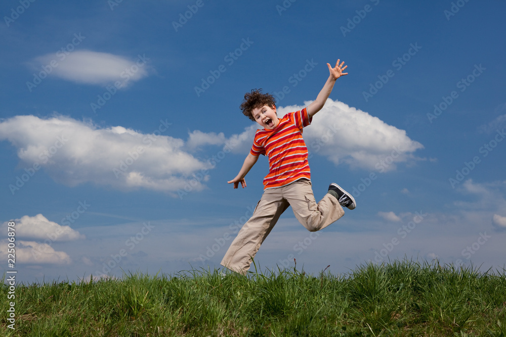 Girl and boy jumping, running against blue sky Girl and boy jumping, running against blue sky