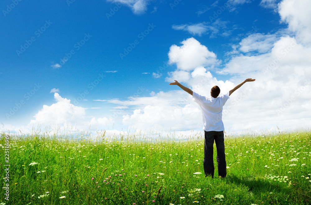 field of grass and happy young man field of grass and happy young man