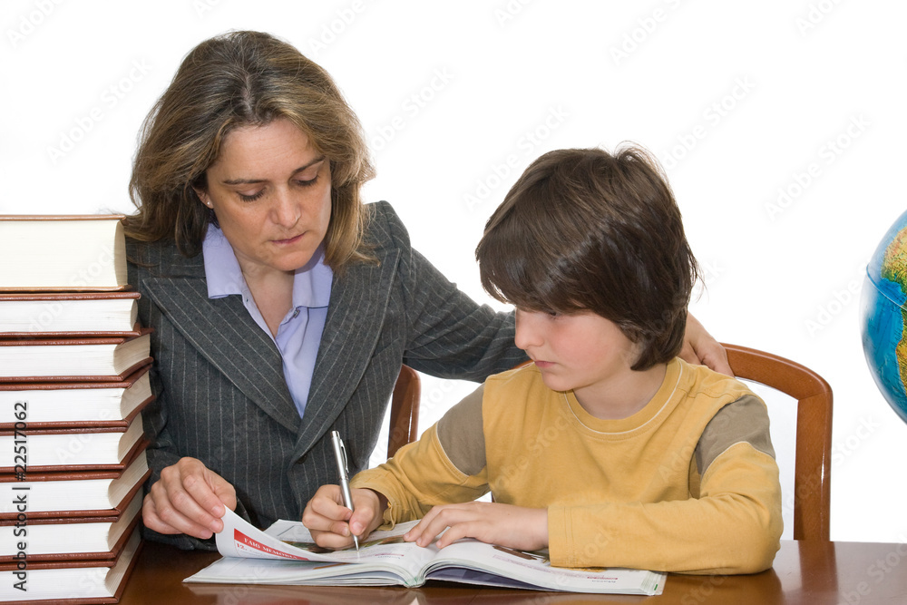 Mother helping her child with the homeworks Mother helping her child with the homeworks