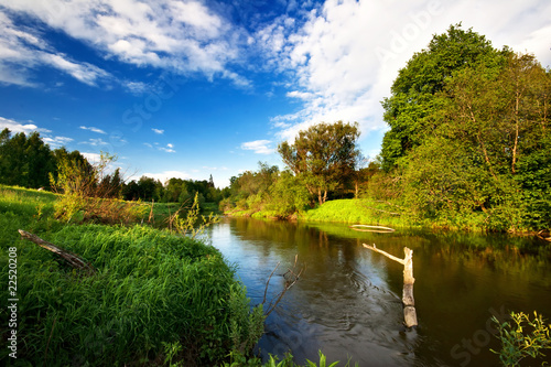 small river under blue sky.The end of summer