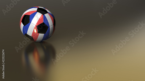 Glossy France soccer ball on golden metal surface