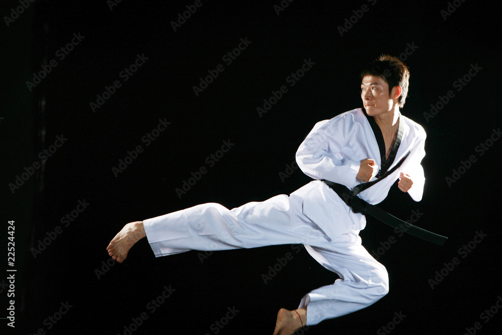 one asian man is playing with taekwondo one asian man is playing with taekwondo