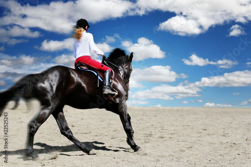 Teenage girl horseback riding