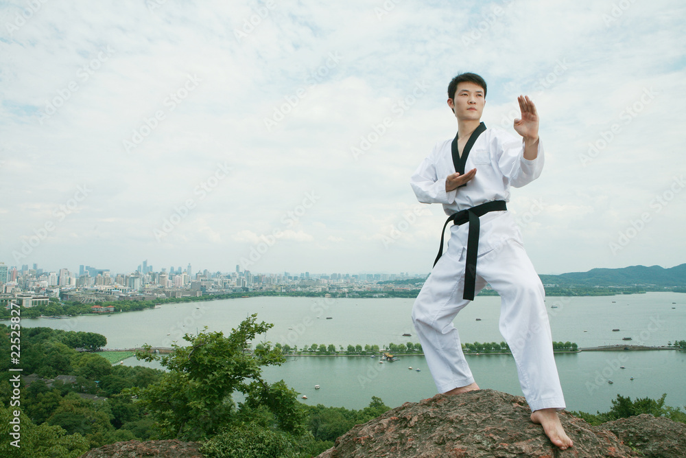 one asian man playing with taekwondo outdoor one asian man playing with taekwondo outdoor