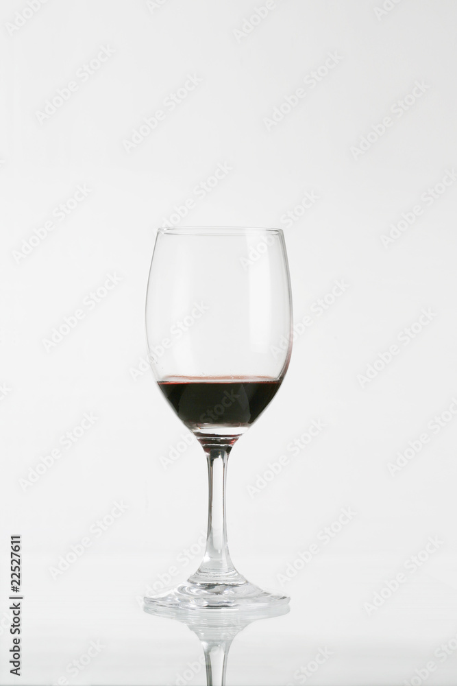 Red wine in wineglass isolated on white background .. Red wine in wineglass isolated on white background ..